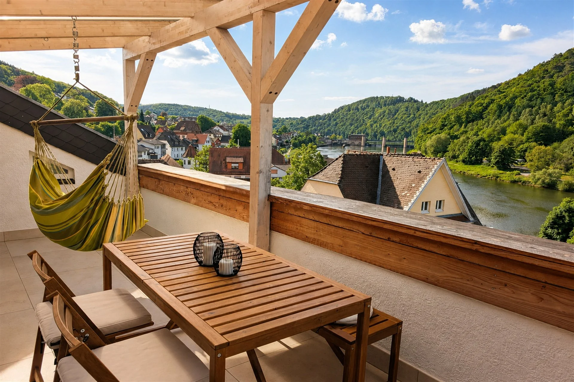 Large covered balcony with views across the Neckar and green hills